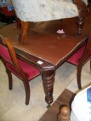 A wind out table and 4 chairs