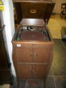 An oak cased HMV cabinet gramaphone