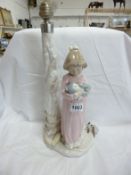 A NAO table lamp, girl with rabbit, (overall height 45cm)