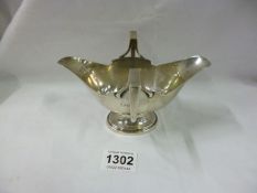 A silver twin handled sauce boat, 178 grammes