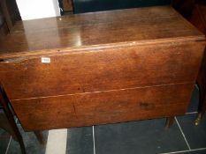 An oak drop leaf table