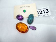 A quantity of loose stones including opal, citrine & amethyst
