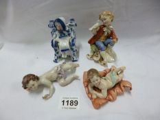 4 Victorian porcelain figures including piano babies