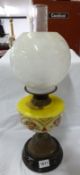 A Victorian oil lamp on pot base with hand painted font