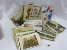 A quantity of old postcards.