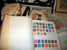 A quantity of first day covers and an album of stamps