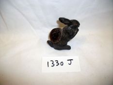 A spelter rabbit pin cushion