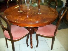 An Italian inlaid table and 6 chairs