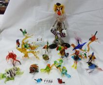 A large quantity of Murano style glass animals, clown etc