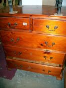 A pine 2 over 3 chest of drawers