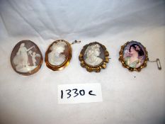 3 Cameo brooches and one other