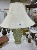 An Oriental table lamp with shade