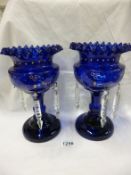 A pair of blue glass lustres, missing some droppers