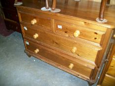 A pine 2 over 2 chest of drawers