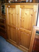 A pine 2 door cupboard