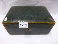 A leather bound jewellery box and jewellery