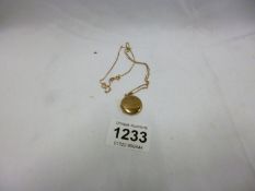 A 9ct gold locket on 9ct gold chain
