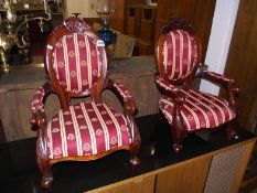 A pair of miniature mahogany chairs