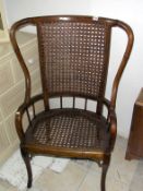 A period chair with cane seat and back