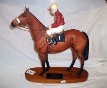 A Beswick 'Red Rum' on wooden base