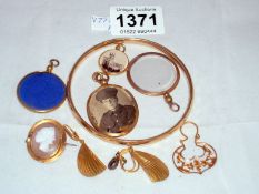 A small mixed lot including 4 lockets and a bangle