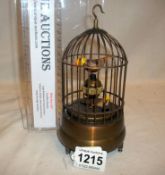 A bird in cage automatum alarm clock