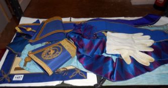A quantity of Masonic regalia, 3 aprons, 7 sashes, Pr cuffs & pr gloves