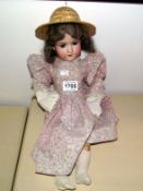 An Armand Marselle 390 Porcelain headed doll, feet a/f