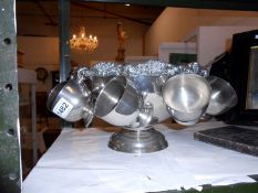 A silver plated punch bowl, cups and ladel