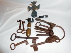 A mixed lot including keys, tin openers & whistle etc.