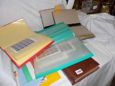 3 folders of stamps etc., and 4 old ledgers
