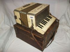 A Hohner student accordian in case
