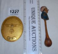 A Nazi Postman's cap badge and a German wooden spoon