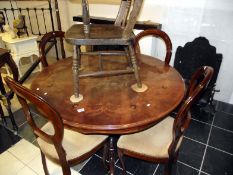 An inlaid table and 4 chairs