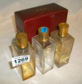 A cased set of 3 Baccarat bottles