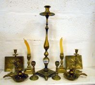 4 pairs of brass candlesticks, a tall candlestick, 2 chamber sticks and 2 plaques