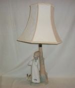 A NAO by Lladro boy with alarm clock table lamp