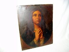 A picture on board of a woman praying