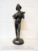 A bronze minstrel figure