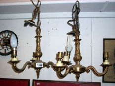 A pair of gilded 3 lamp ceiling lights