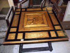 An inlaid table with parquetry panel