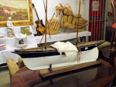 A model sailing boat named 'Bella'