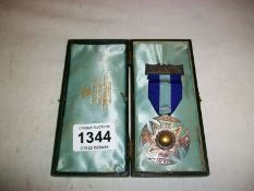 A cased silver medal