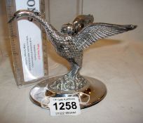 A silver plated swan oil burner