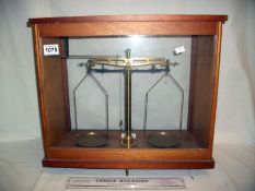 A cased set of apothecary scales