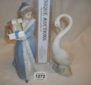 2 NAO figurines, girl with presents and a goose