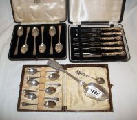 2 cased sets of silver spoons, a cased set of silver handled knives and 2 other spoons