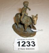 An early bronze miniature boy on goat