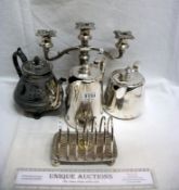A silver plated toast rack, candelabra, 2 teapots and coffee pot
