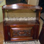 A mahogany wall cabinet